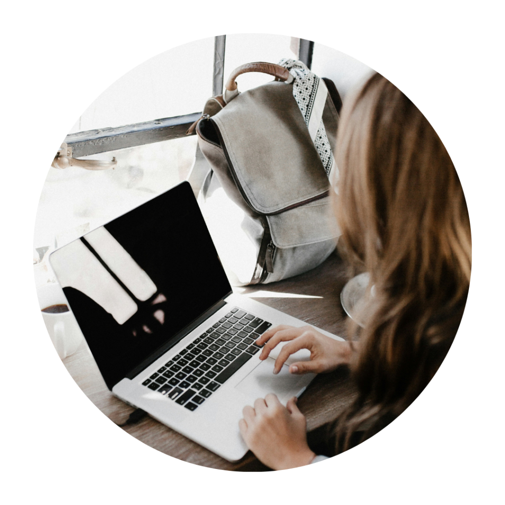 Lady typing on a laptop keyboard